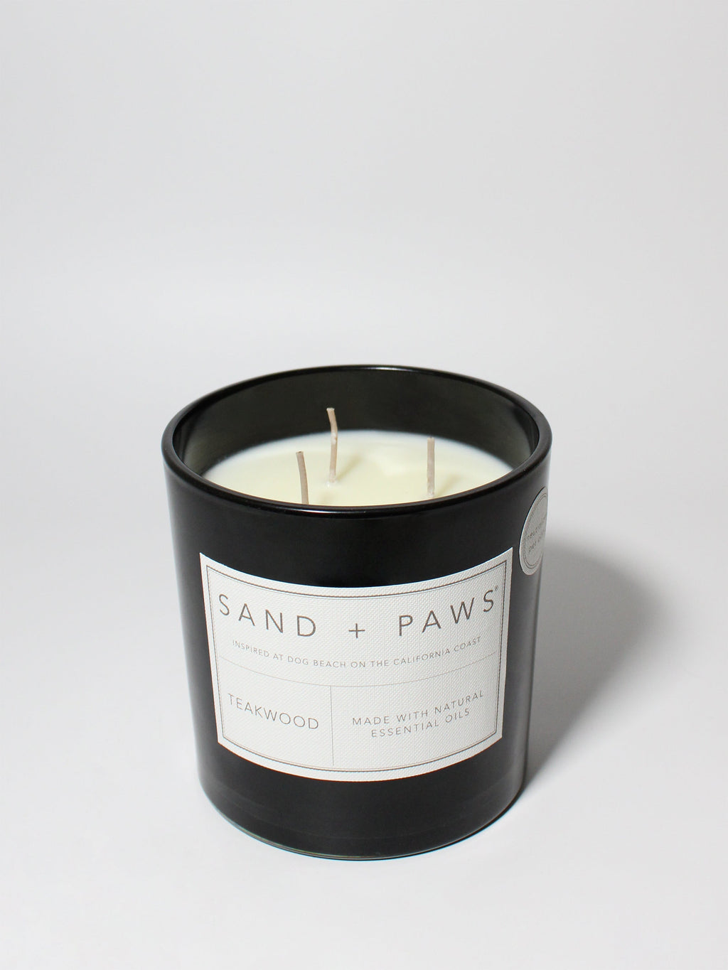 Premium Cozy Sand + Paws Teakwood 21 oz scented candle