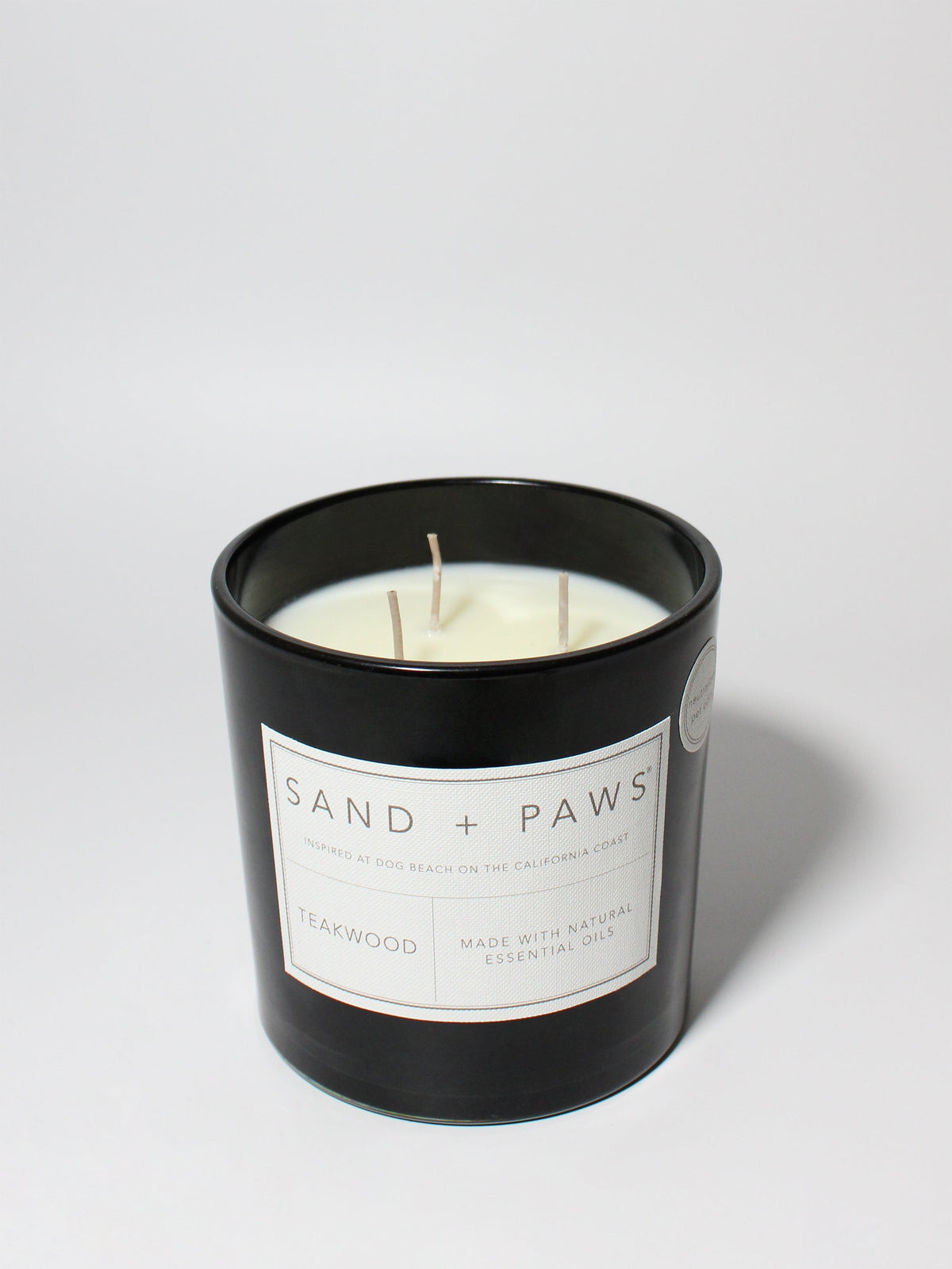 Premium Cozy Sand + Paws Teakwood 21 oz scented candle